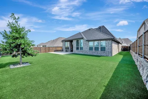 a view of a backyard with a garden
