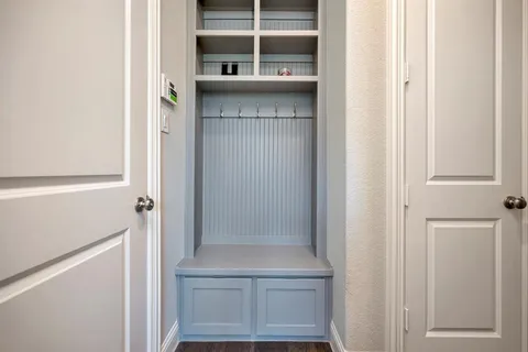 a bathroom with a bathtub and a window