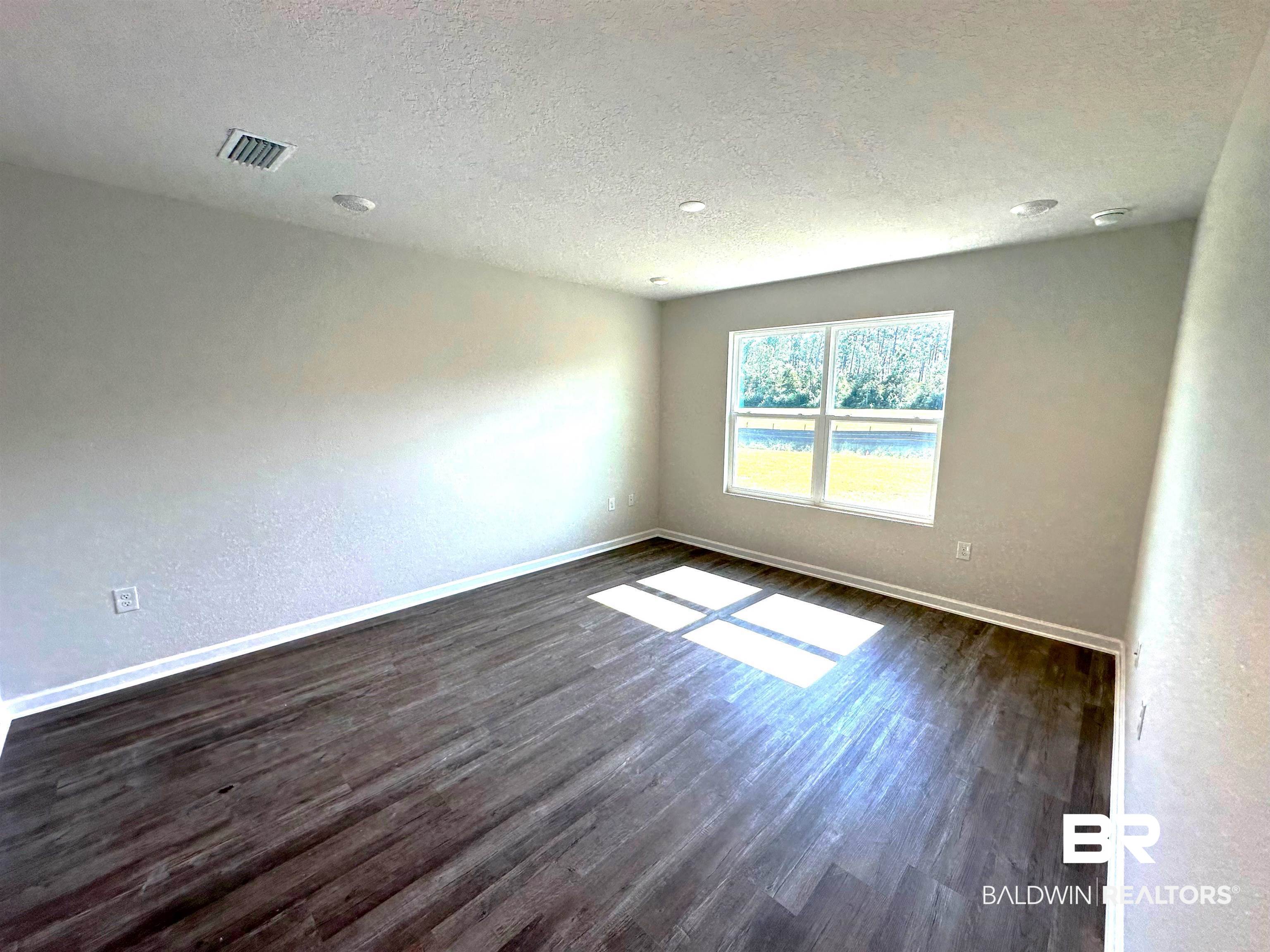 1243 Hayward Loop Foley, AL 36535 - Photo 10 of 32 Primary Bedroom
