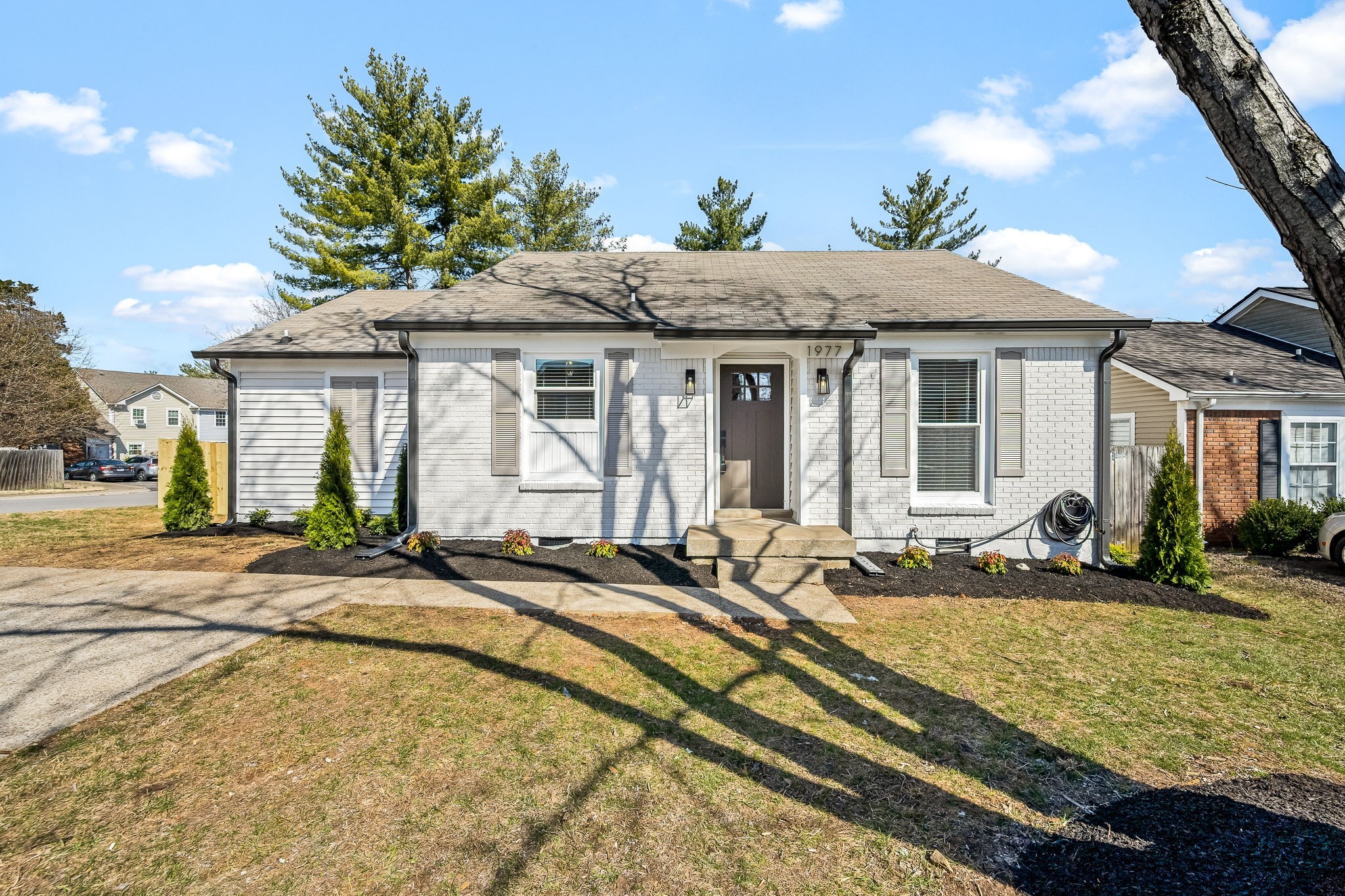 a front view of a house with a yard