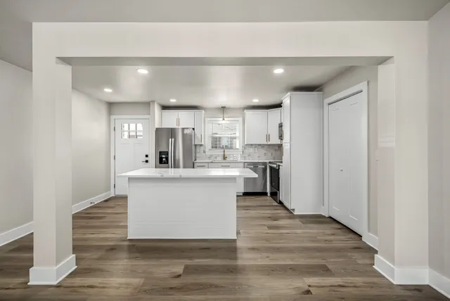 a view of kitchen with wooden floor
