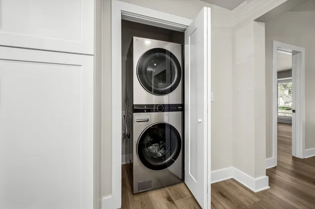 a view of a hallway with washer and dryer