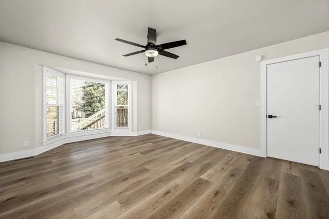 a view of room window and wooden floor