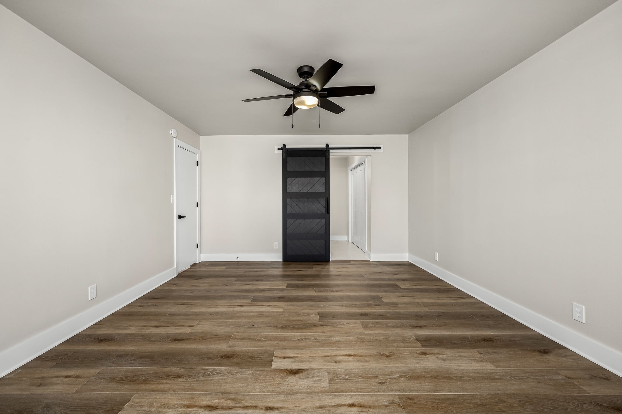 1977 Timberline Way Clarksville, TN 37042 - Photo 18 of 39 a view of a kitchen with wooden floor and a ceiling fan