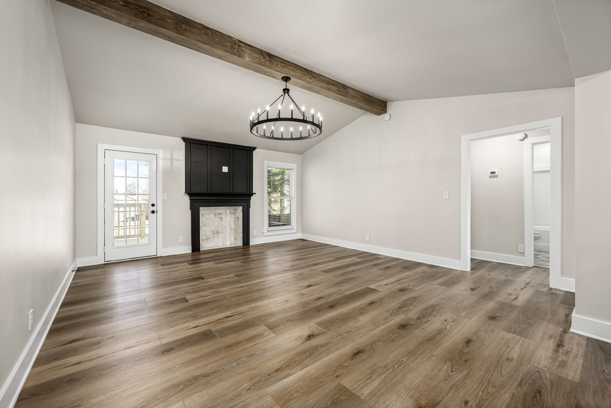 1977 Timberline Way Clarksville, TN 37042 - Photo 2 of 39 a view of an empty room with wooden floor and windows