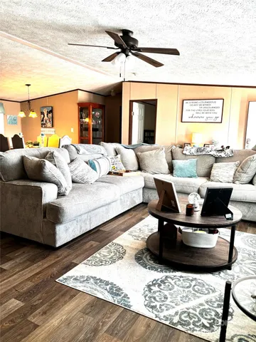 a living room with furniture and a rug