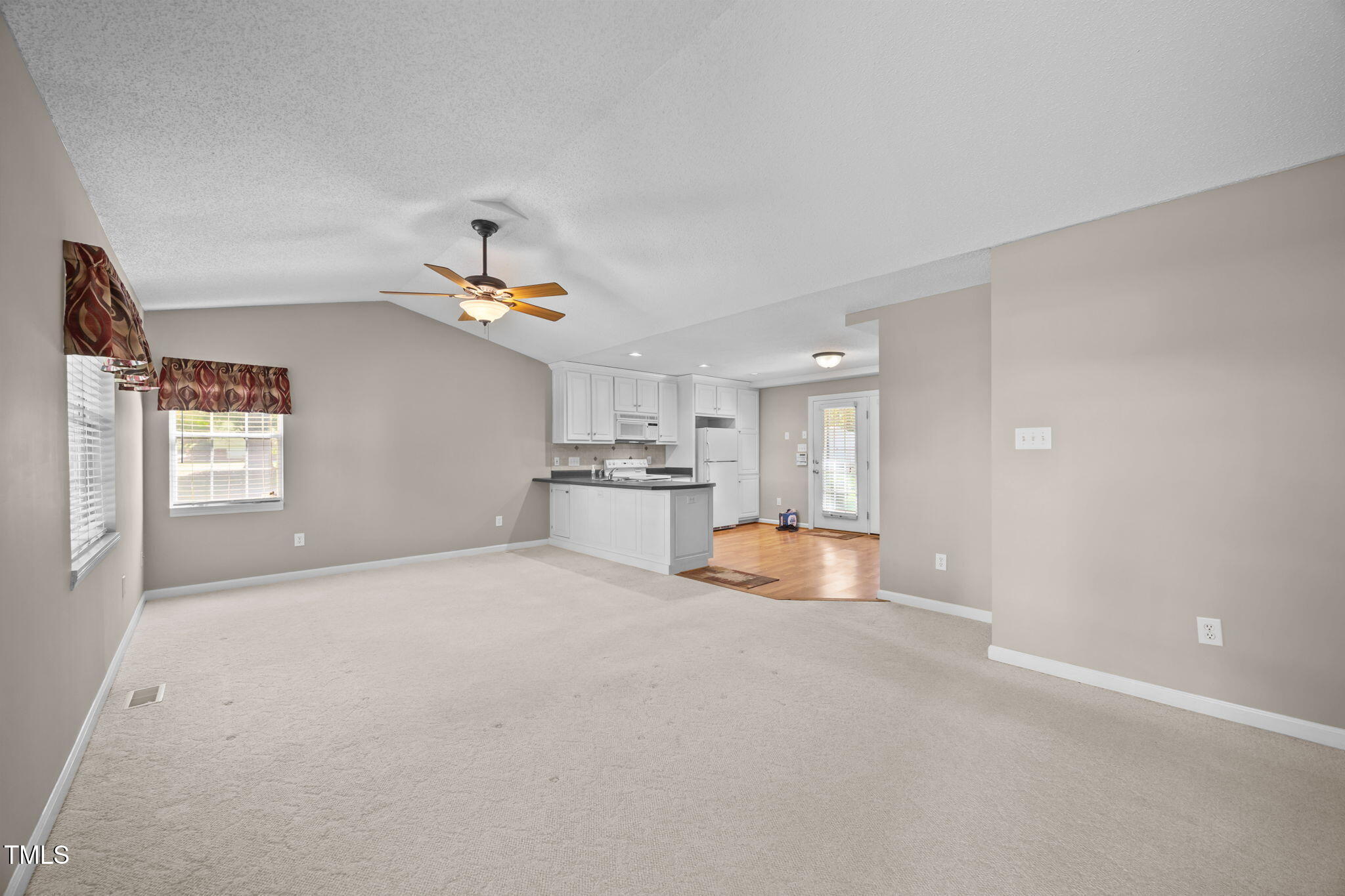 2819 John Lewis Road Burlington, NC 27217 - Photo 3 of 40 Vaulted living room open to kitchen.