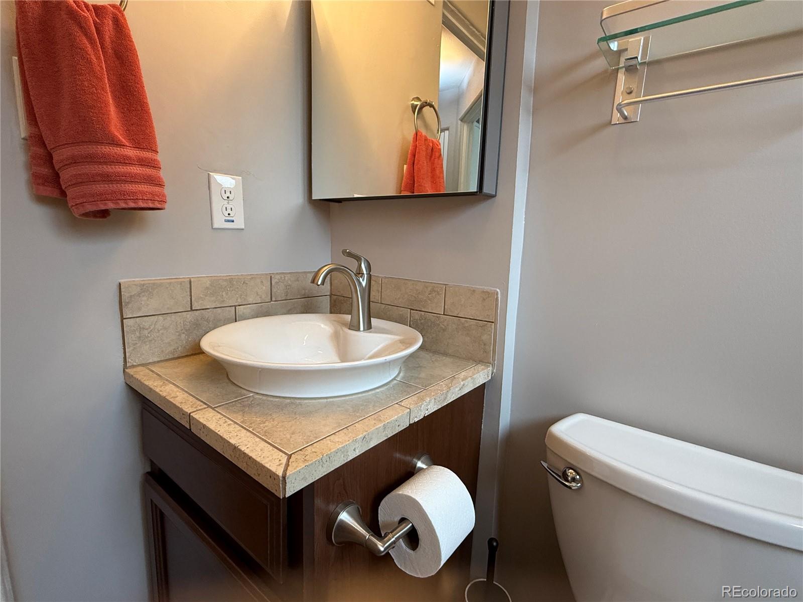 1920 Willow Street Denver, CO 80220 - Photo 14 of 41 a bathroom with a sink and a toilet