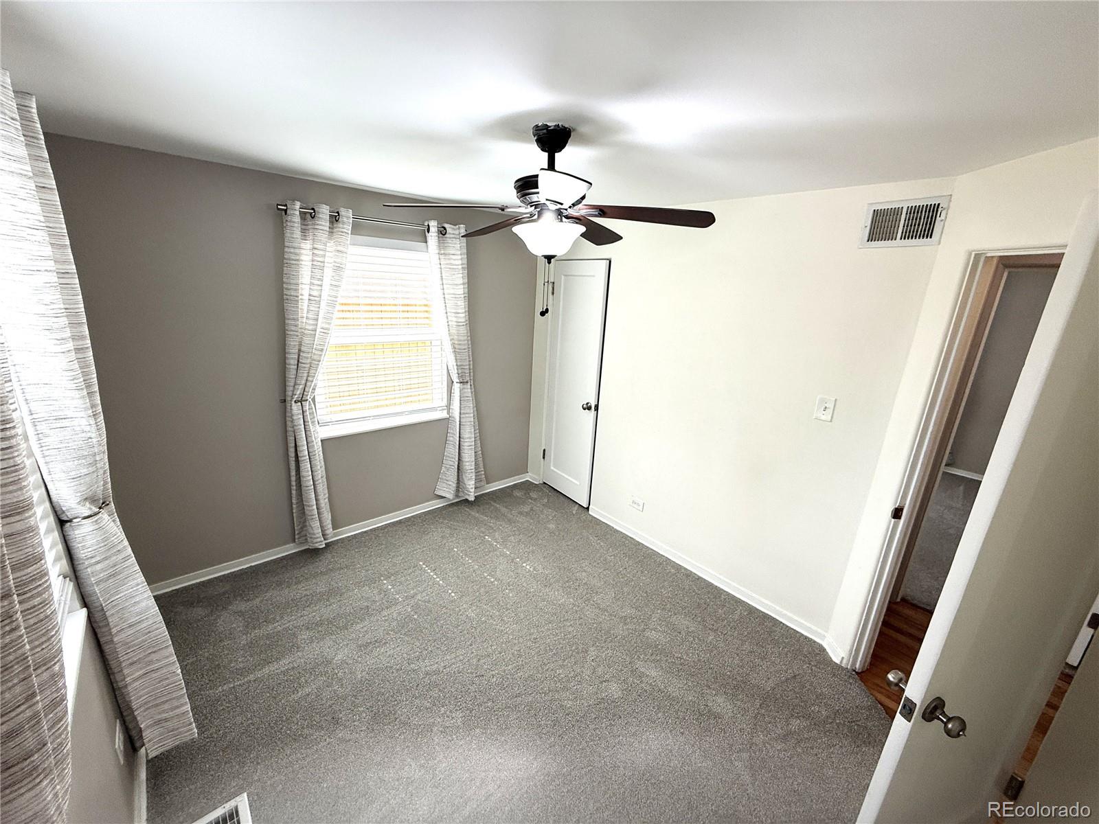 1920 Willow Street Denver, CO 80220 - Photo 17 of 41 a view of empty room with windows