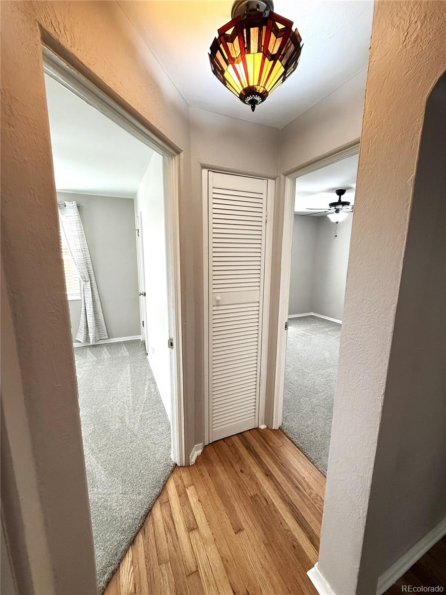 1920 Willow Street Denver, CO 80220 - Photo 18 of 41 view of a hallway with a chandelier