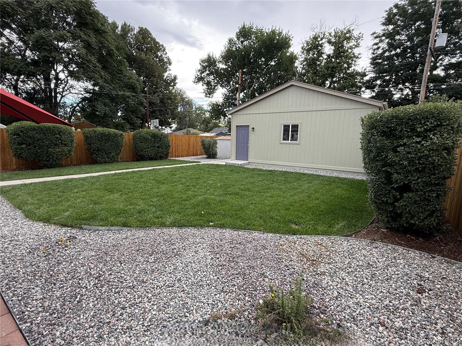 1920 Willow Street Denver, CO 80220 - Photo 2 of 41 a view of a house with a yard