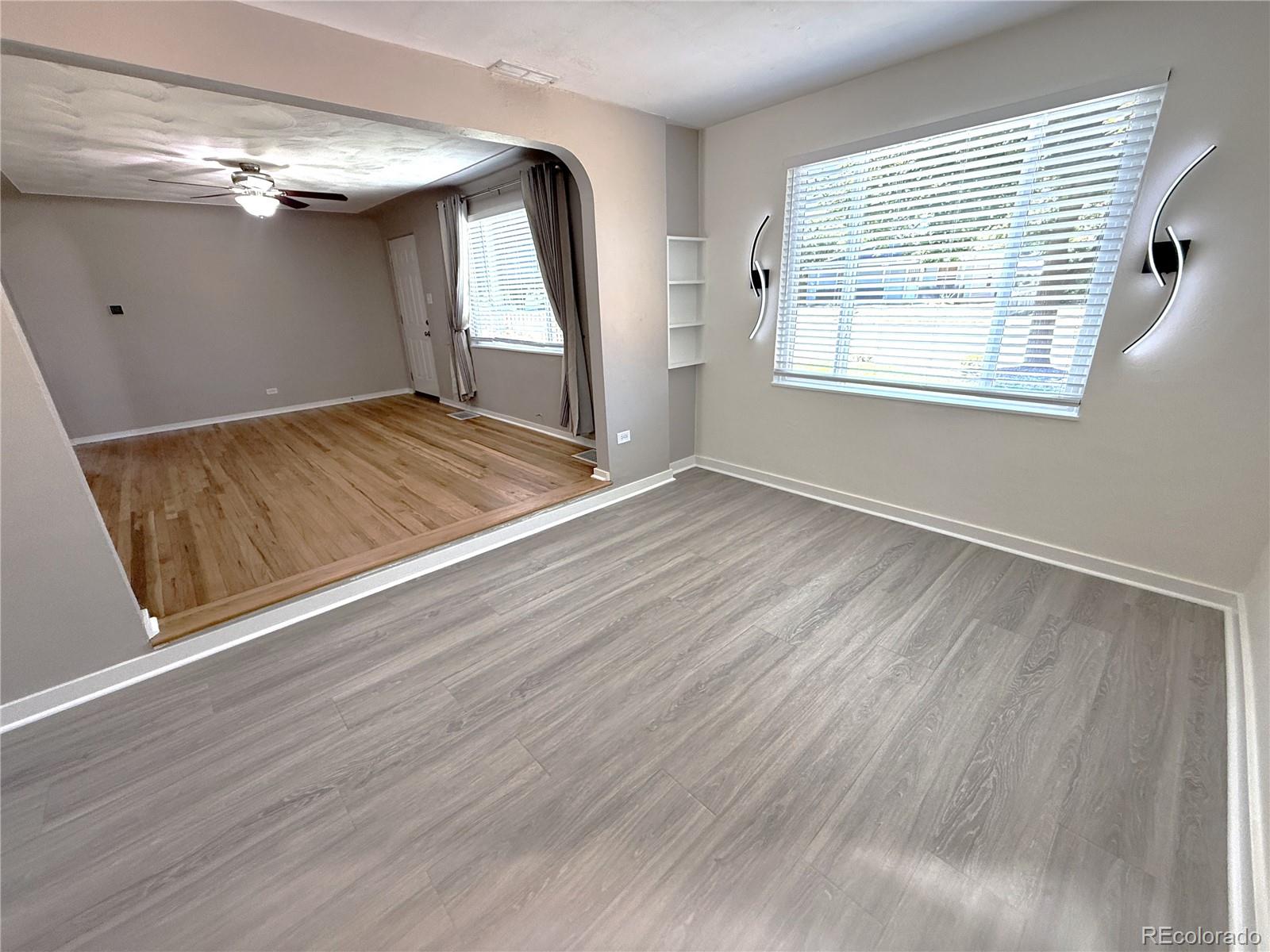 1920 Willow Street Denver, CO 80220 - Photo 27 of 41 a view of an empty room with wooden floor and a window