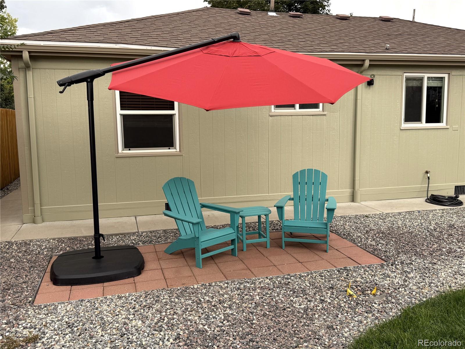 1920 Willow Street Denver, CO 80220 - Photo 3 of 41 a front view of a house with outdoor seating