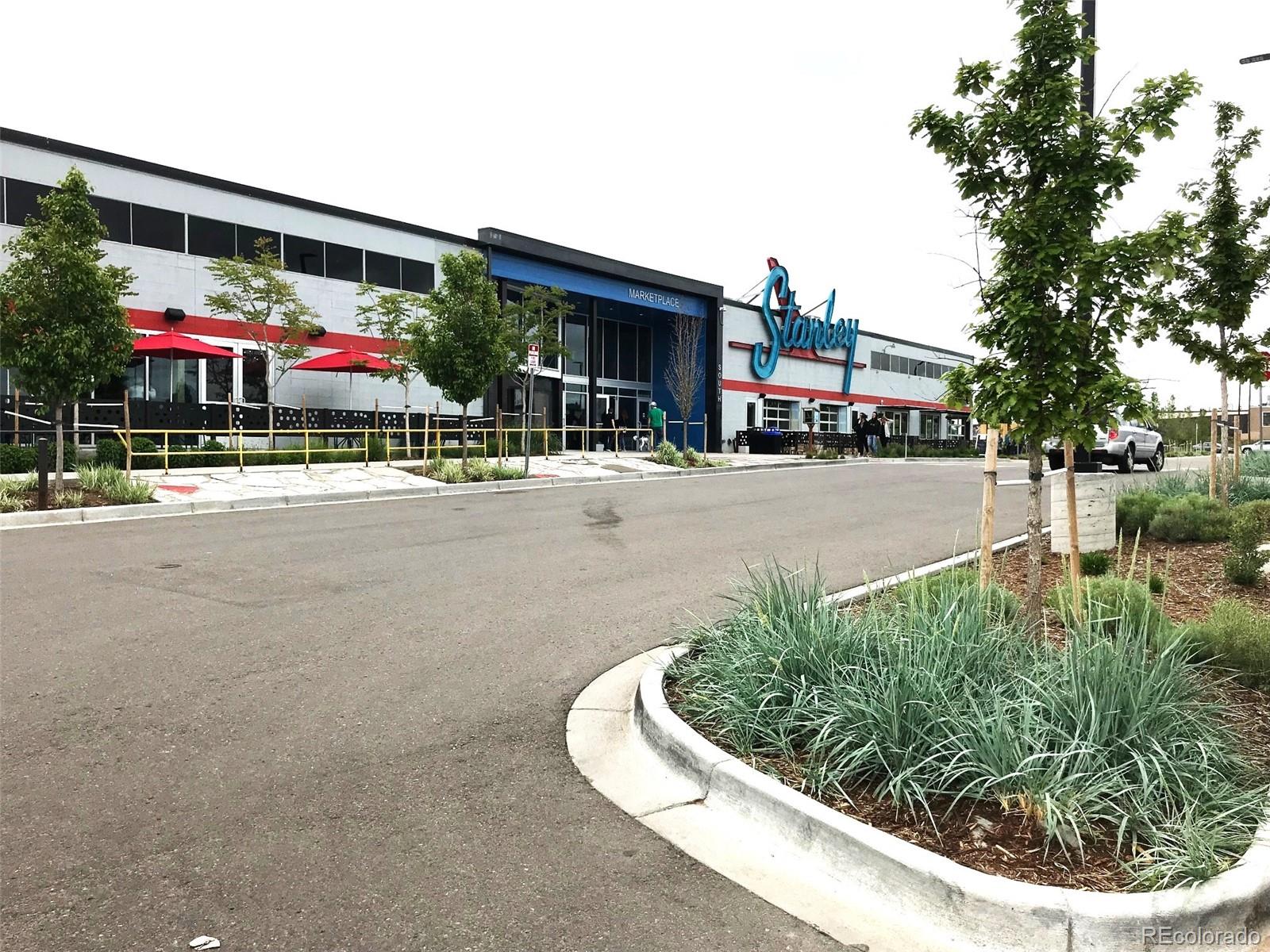1920 Willow Street Denver, CO 80220 - Photo 37 of 41 a building with trees in front of it