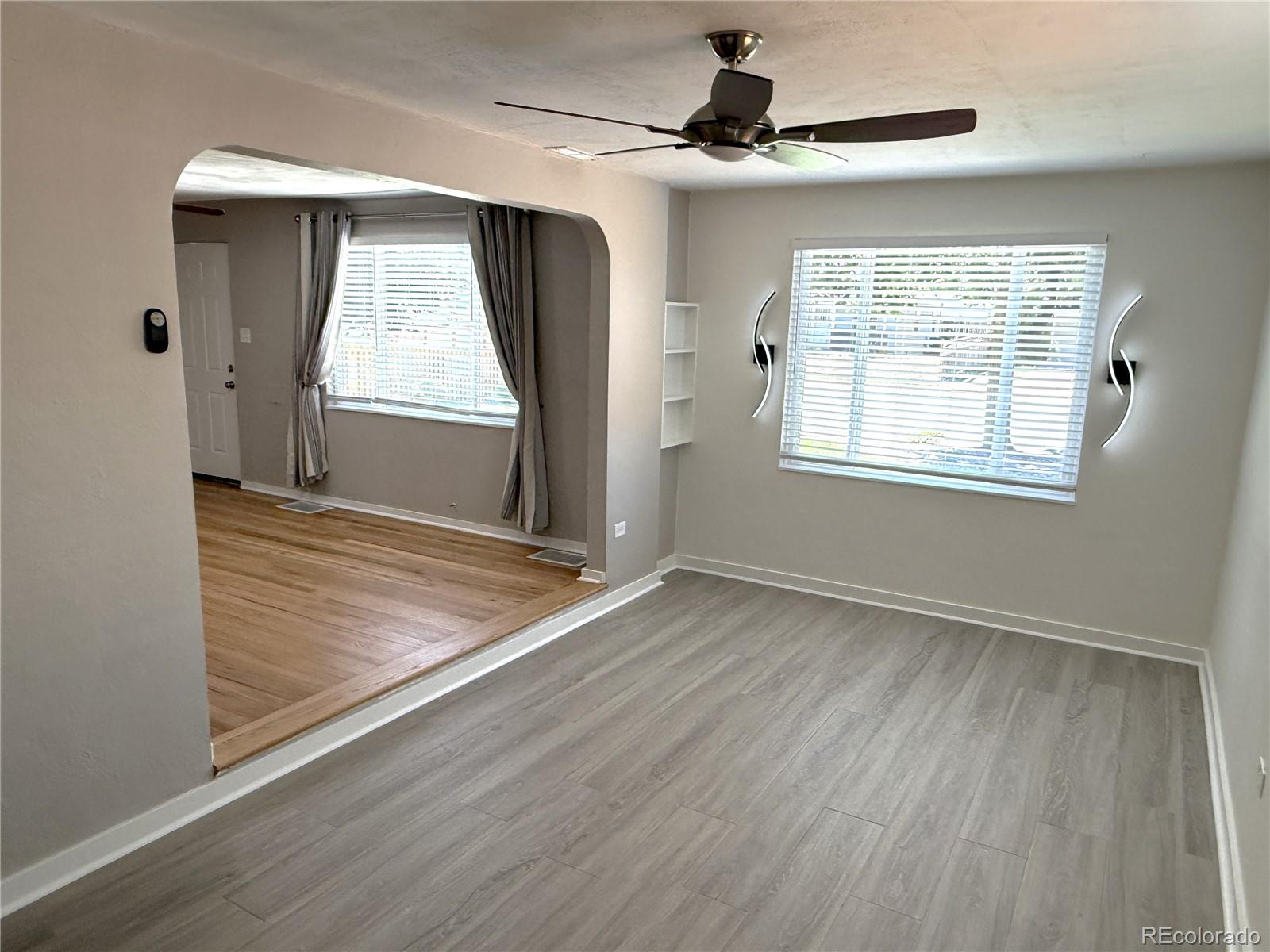 1920 Willow Street Denver, CO 80220 - Photo 9 of 41 wooden floor in an empty room with a window