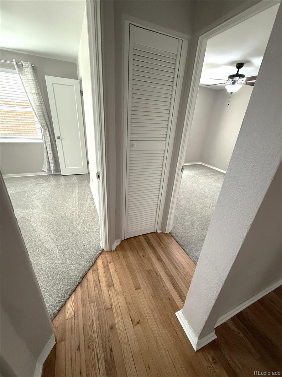 1920 Willow Street Denver, CO 80220 - Photo 10 of 41 a view of a hallway view with wooden floor and staircase