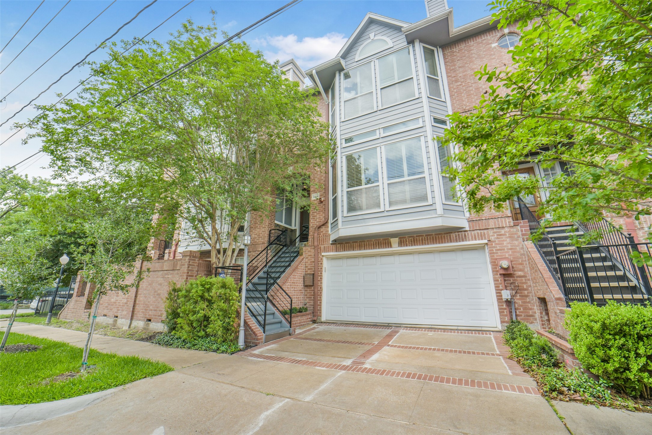 2026 Welch Street Houston, TX 77019 - Photo 2 of 28 Classic red brick townhome