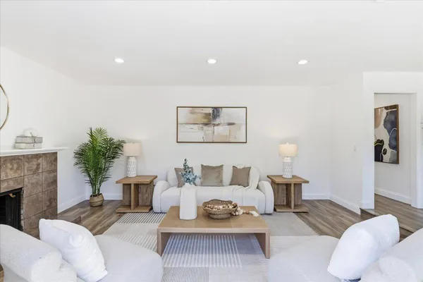 a bedroom with a bed and a painting on the wall