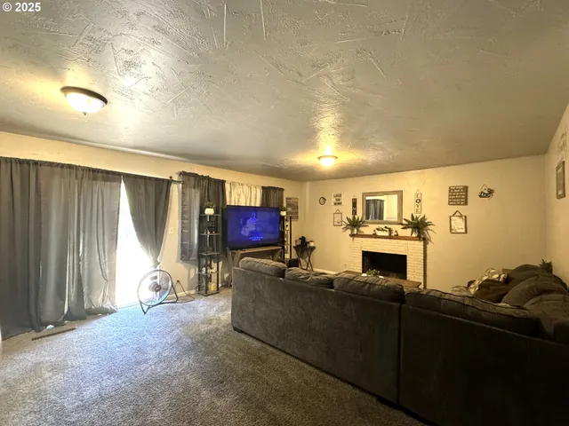 a living room with a fireplace