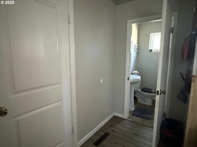 a bathroom with a toilet and a sink
