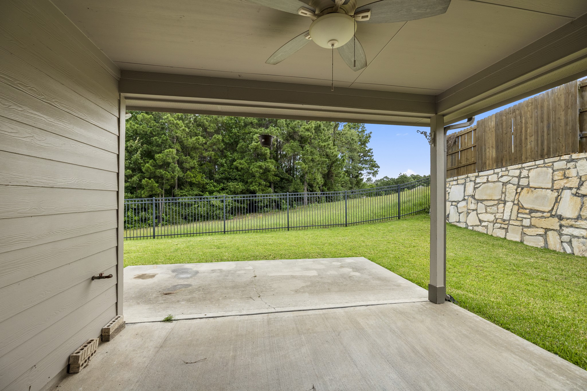 12340 Delta Timber Road Conroe, TX 77304 - Photo 36 of 41 Large covered back porch overlooks the backyard backing up to greenbelt.