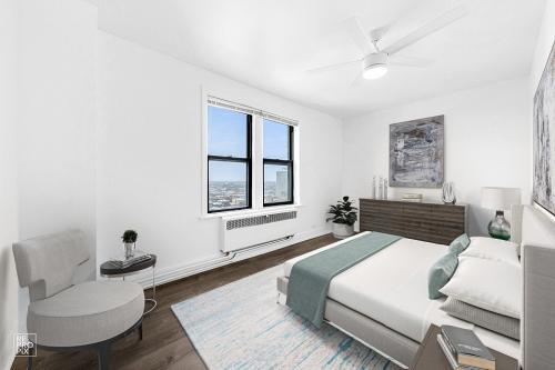 6230 North Kenmore Avenue, Unit 1107 Chicago, IL 60660 - Photo 4 of 10 a bedroom with a bed and wooden floor