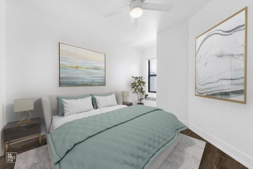 6230 North Kenmore Avenue, Unit 1107 Chicago, IL 60660 - Photo 6 of 10 a bedroom with a bed and a painting on the wall