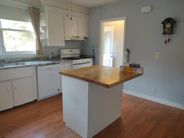 a bathroom with a sink a mirror and a toilet