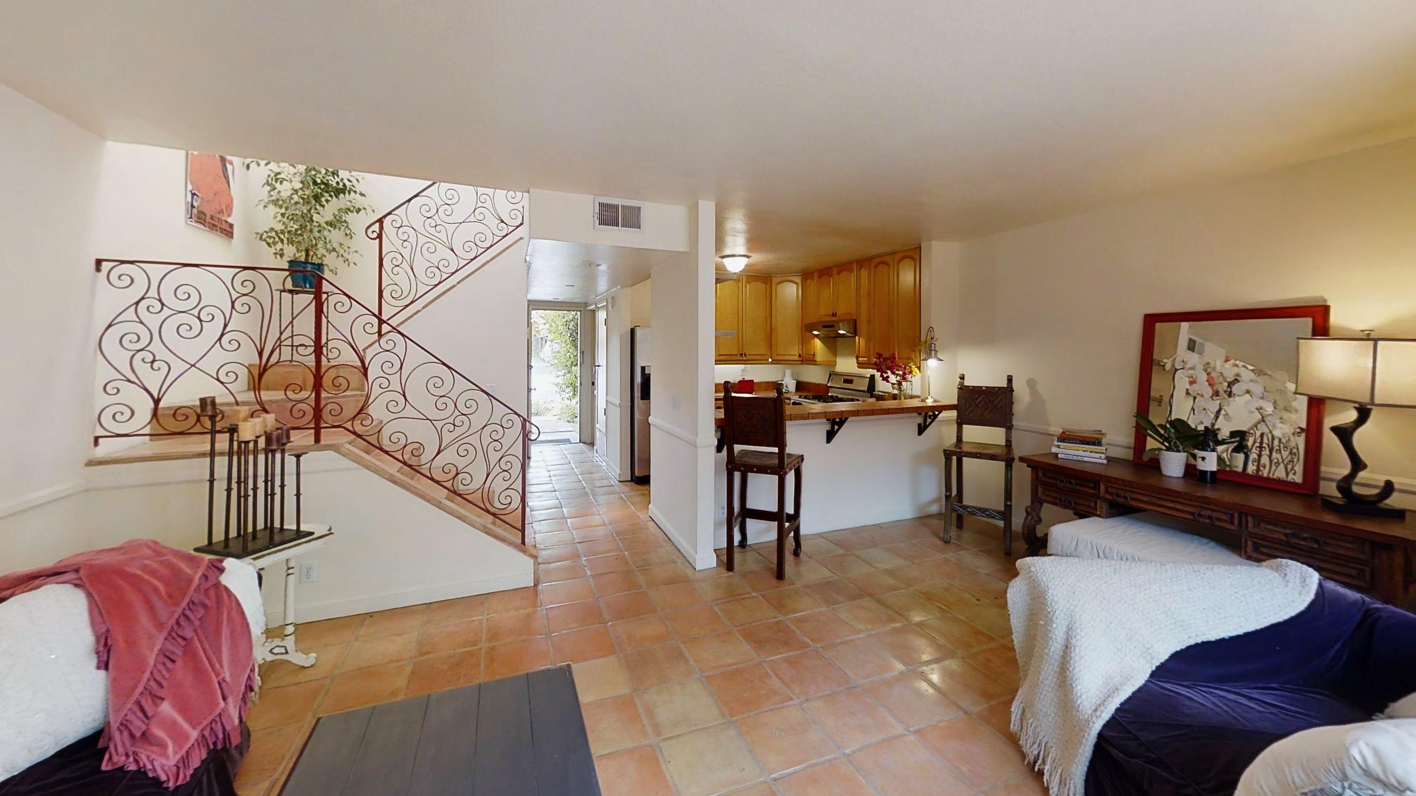 415 West Gutierrez Street, Unit 16 Santa Barbara, CA 93101 - Photo 2 of 12 a living room with furniture and wooden floor