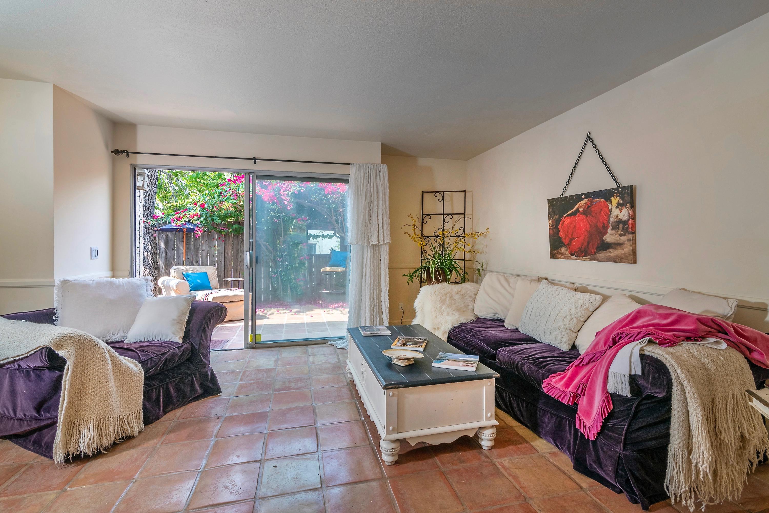 415 West Gutierrez Street, Unit 16 Santa Barbara, CA 93101 - Photo 4 of 12 a living room with furniture and a large window