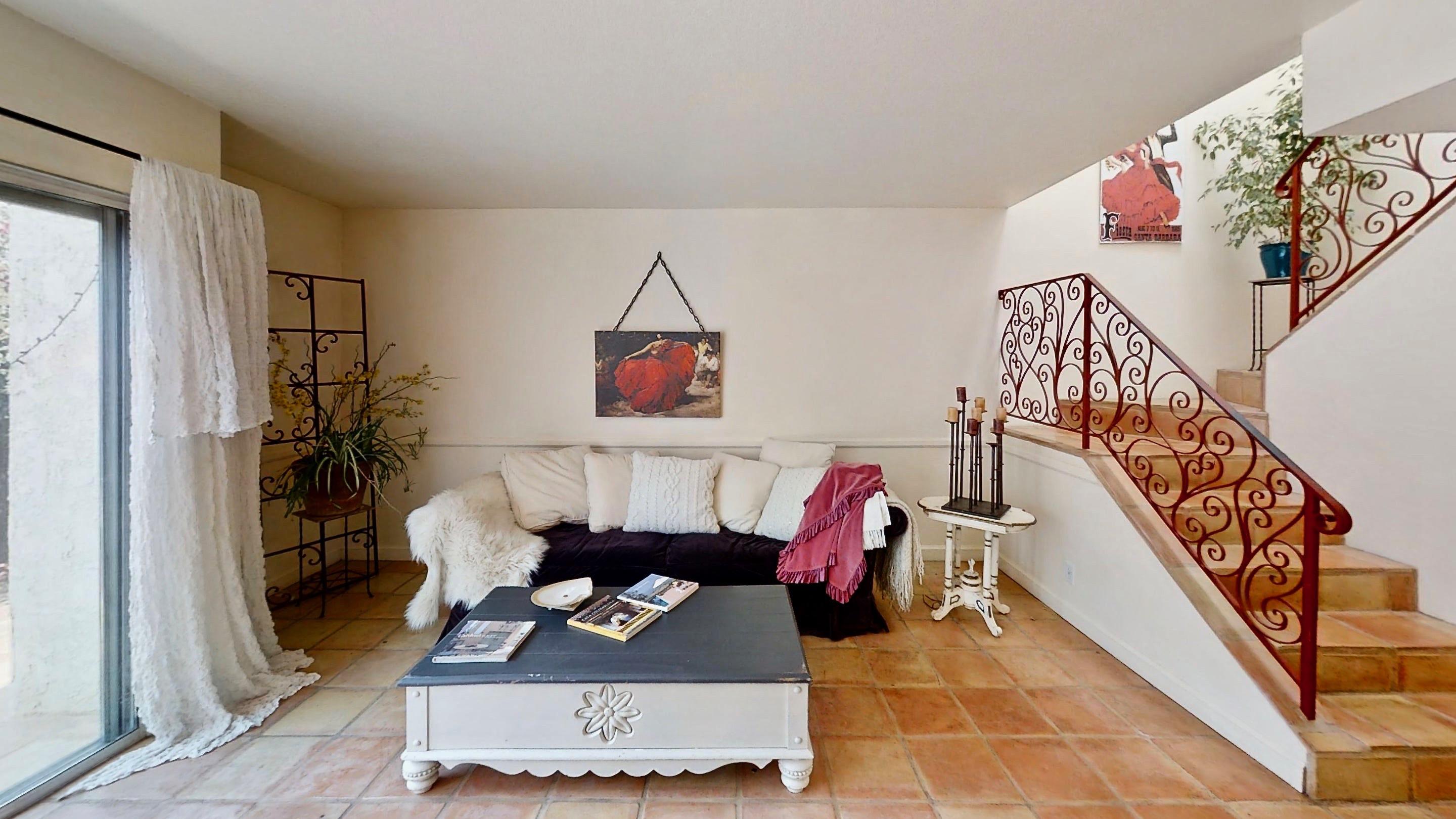 415 West Gutierrez Street, Unit 16 Santa Barbara, CA 93101 - Photo 5 of 12 a living room with furniture and a wooden floor