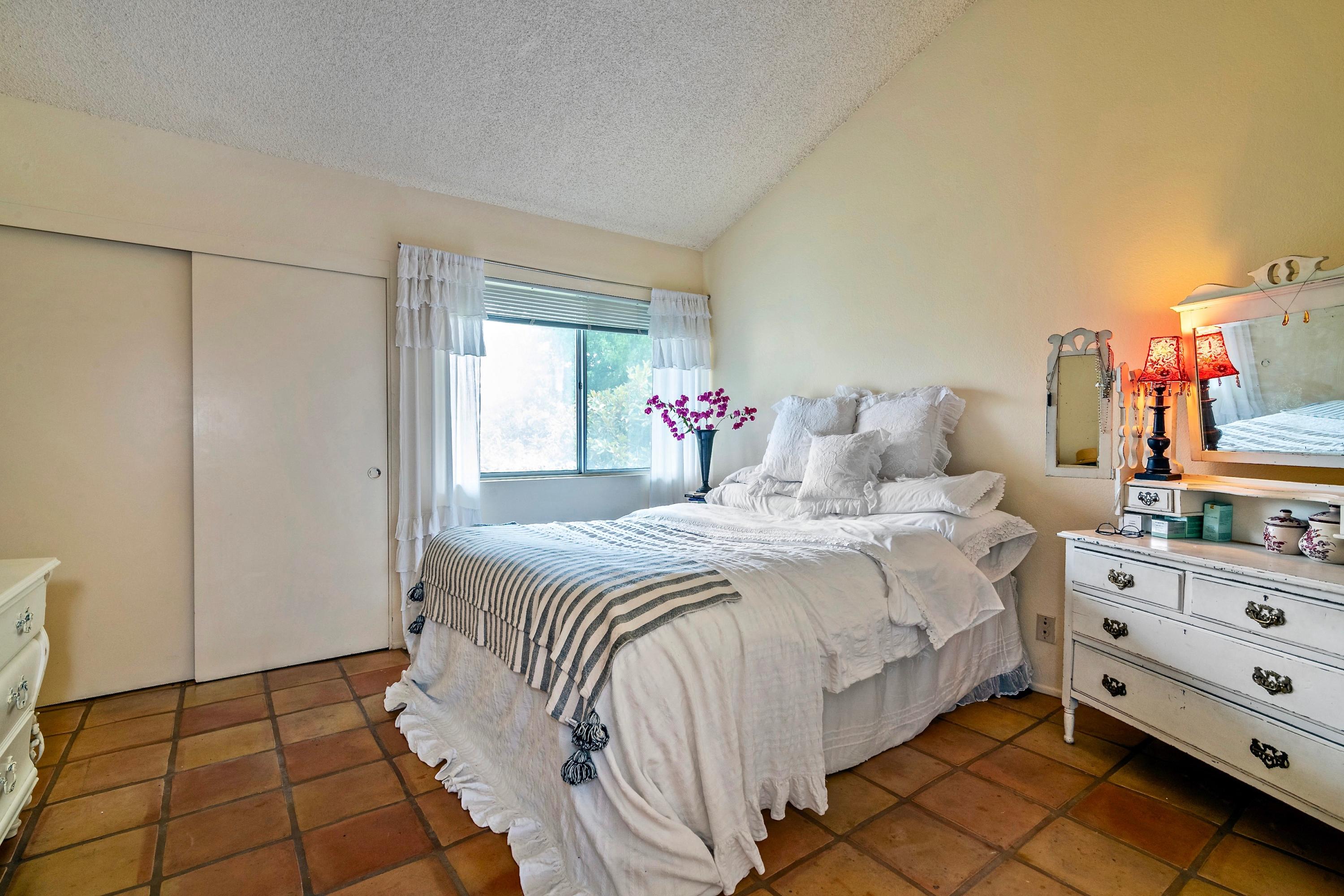 415 West Gutierrez Street, Unit 16 Santa Barbara, CA 93101 - Photo 7 of 12 a bedroom with a bed and a closet