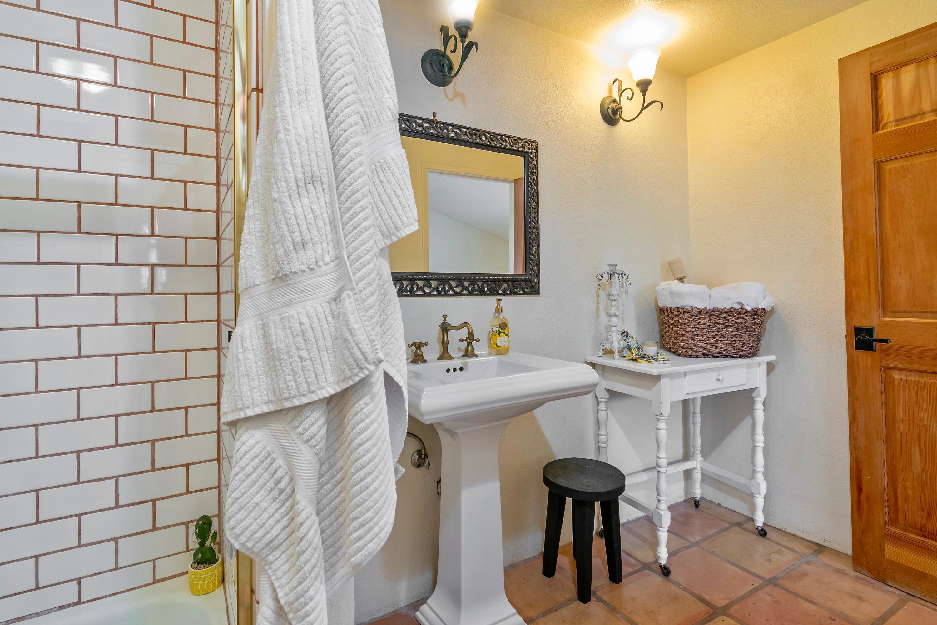 415 West Gutierrez Street, Unit 16 Santa Barbara, CA 93101 - Photo 9 of 12 a bathroom with a sink mirror and tub