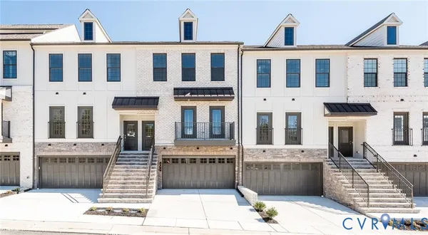 a front view of a building with a terrace