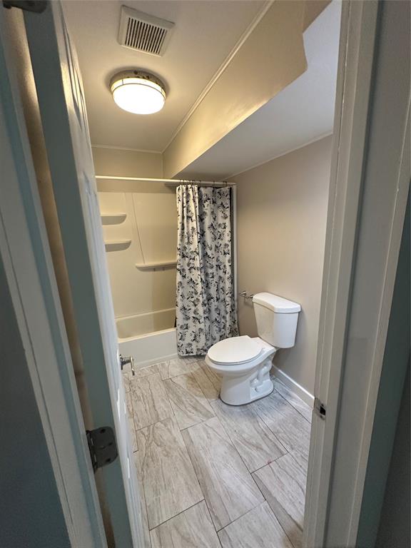 2175 Northeast 56th Street, Unit 106 Fort Lauderdale, FL 33308 - Photo 13 of 20 a bathroom with a toilet and a shower