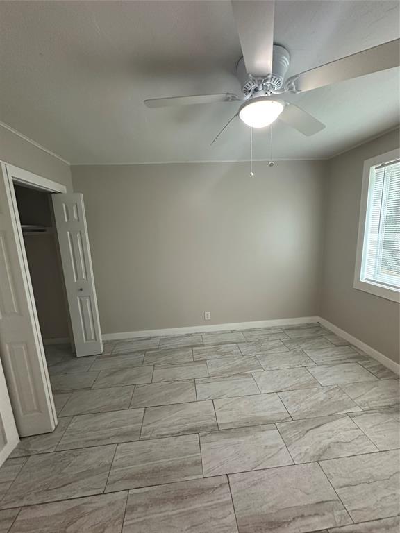 2175 Northeast 56th Street, Unit 106 Fort Lauderdale, FL 33308 - Photo 14 of 20 a view of an empty room with a window