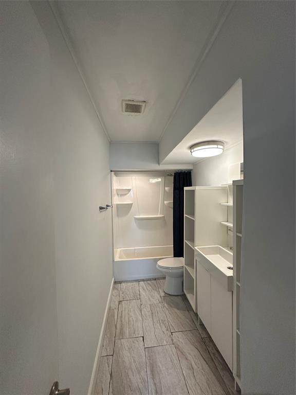 2175 Northeast 56th Street, Unit 106 Fort Lauderdale, FL 33308 - Photo 19 of 20 a bathroom with a toilet and a shower