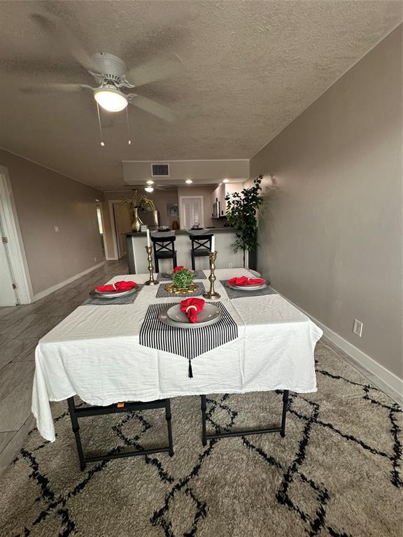 2175 Northeast 56th Street, Unit 106 Fort Lauderdale, FL 33308 - Photo 2 of 20 a view of a dining room with furniture
