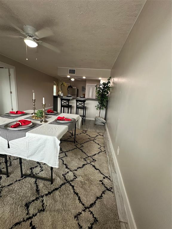 2175 Northeast 56th Street, Unit 106 Fort Lauderdale, FL 33308 - Photo 4 of 20 a room with lots of white furniture and shower