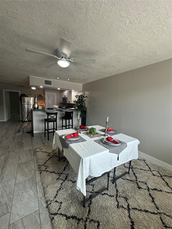 2175 Northeast 56th Street, Unit 106 Fort Lauderdale, FL 33308 - Photo 6 of 20 a view of a dining room with furniture
