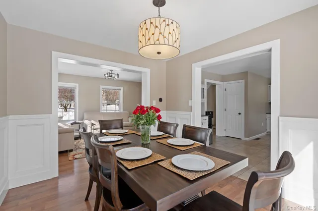 a kitchen with granite countertop a refrigerator and a sink