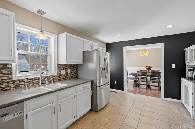 a bathroom with a sink a mirror and vanity