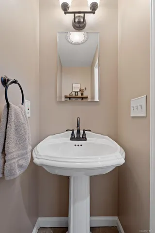a view of a workspace with furniture and wooden floor