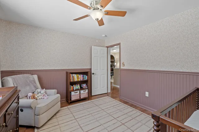a en suite bathroom with a toilet sink and mirror