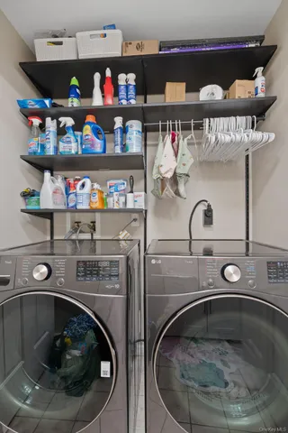 a bedroom with a bed and a flat tv screen on dresser
