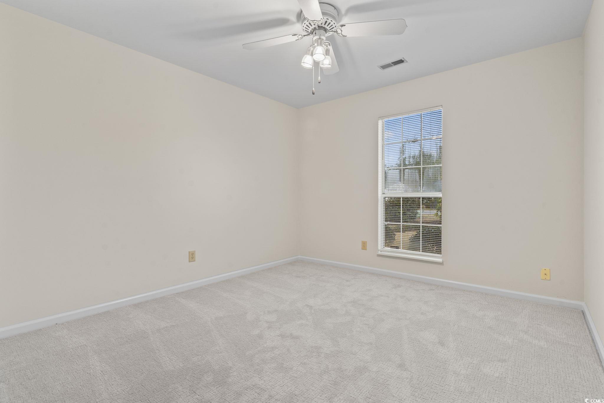 116 Purple Martin Drive Murrells Inlet, SC 29576 - Photo 11 of 40 Carpeted empty room with ceiling fan