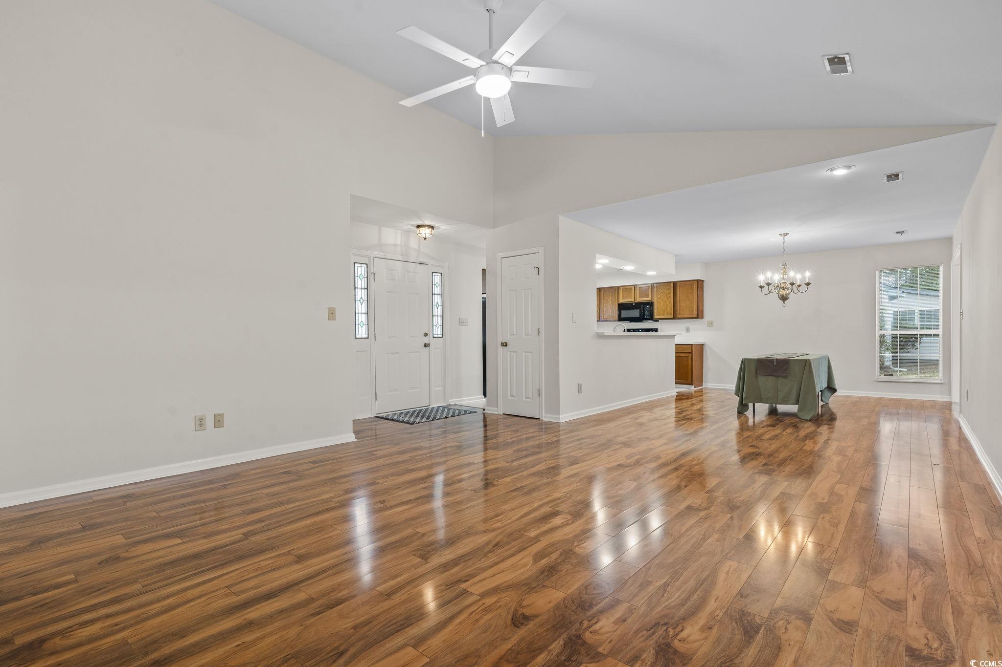 116 Purple Martin Drive Murrells Inlet, SC 29576 - Photo 15 of 40 Unfurnished living room with ceiling fan with nota