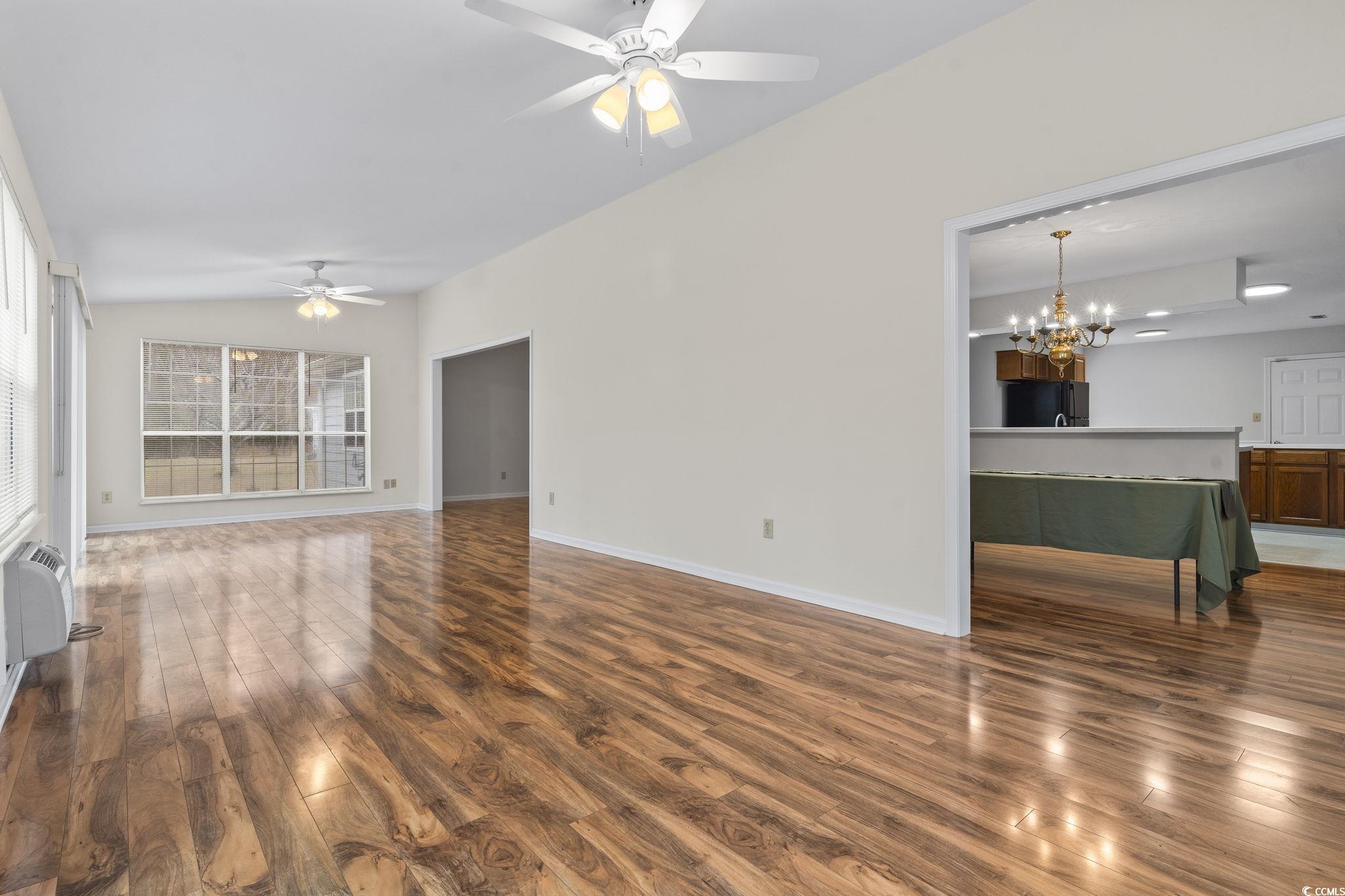 116 Purple Martin Drive Murrells Inlet, SC 29576 - Photo 18 of 40 Living room featuring an AC wall unit, hardwood /