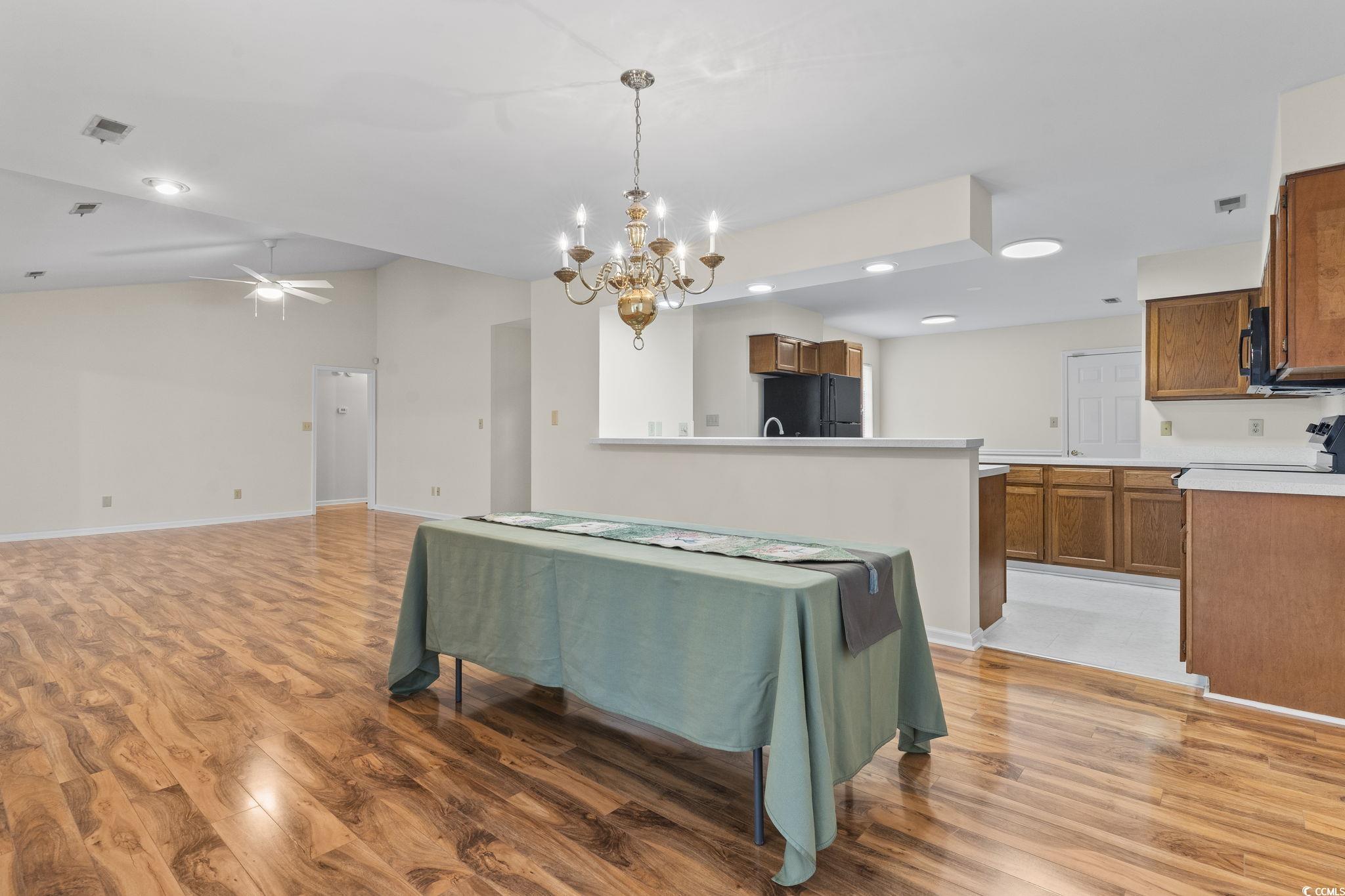 116 Purple Martin Drive Murrells Inlet, SC 29576 - Photo 19 of 40 Kitchen featuring hanging light fixtures, hardwood