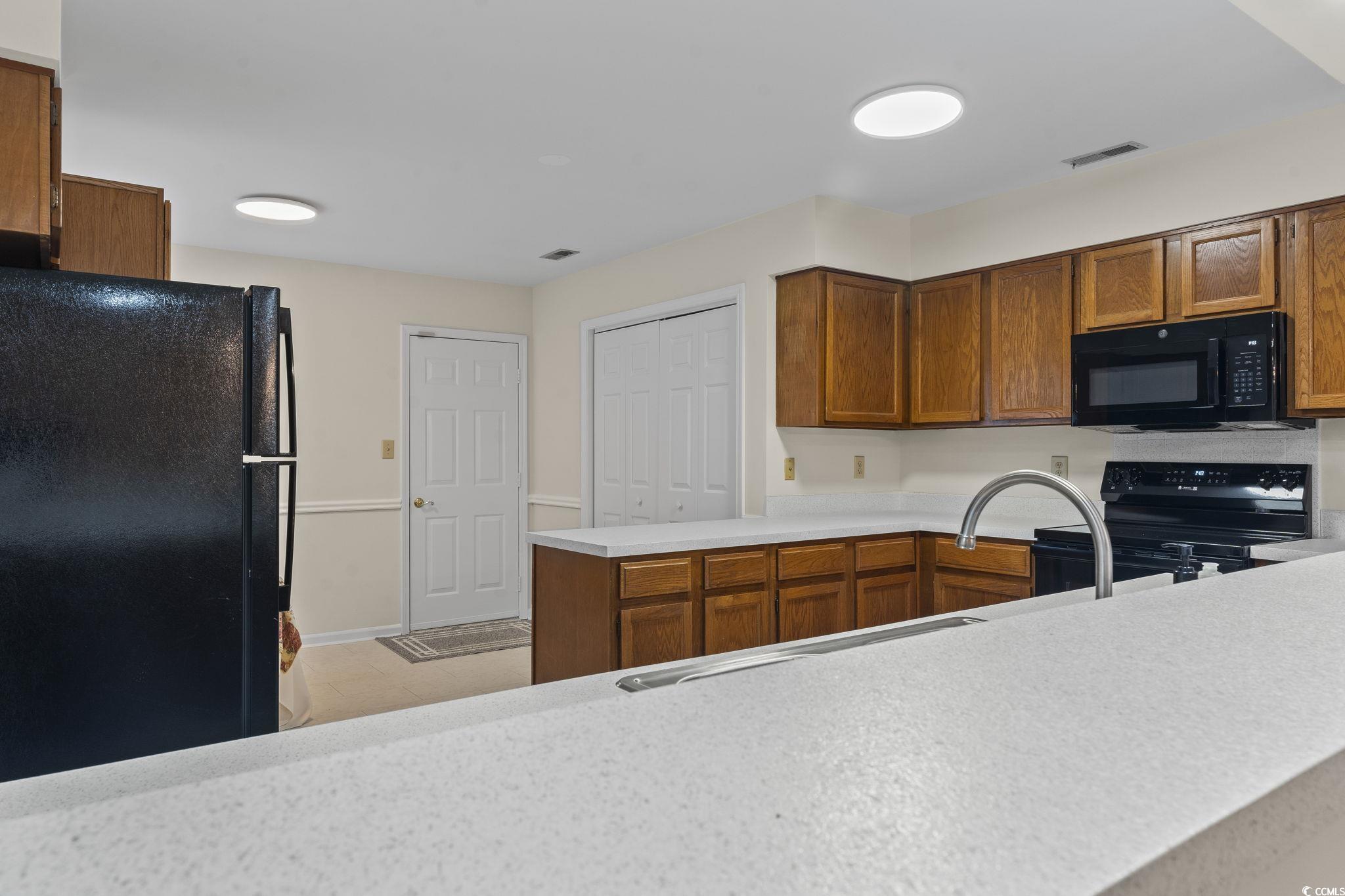 116 Purple Martin Drive Murrells Inlet, SC 29576 - Photo 22 of 40 Kitchen featuring kitchen peninsula and black appl
